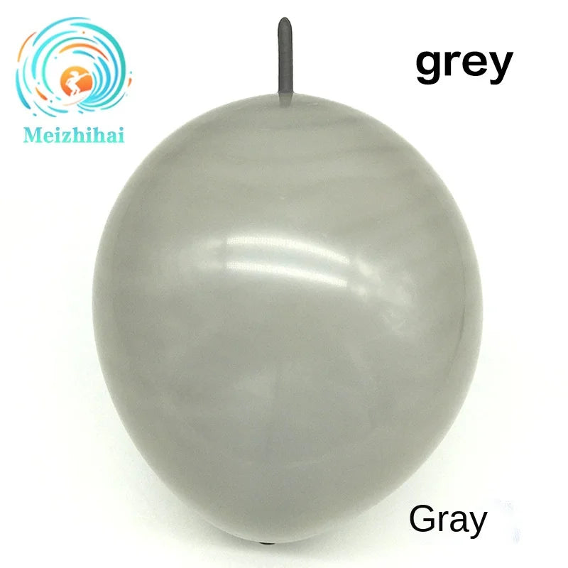 A smooth, grey latex balloon is shown against a white background.