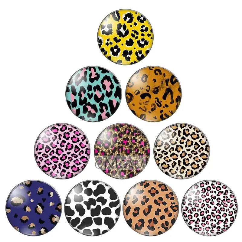 A collection of round glass cabochons featuring various leopard print patterns for jewelry making.