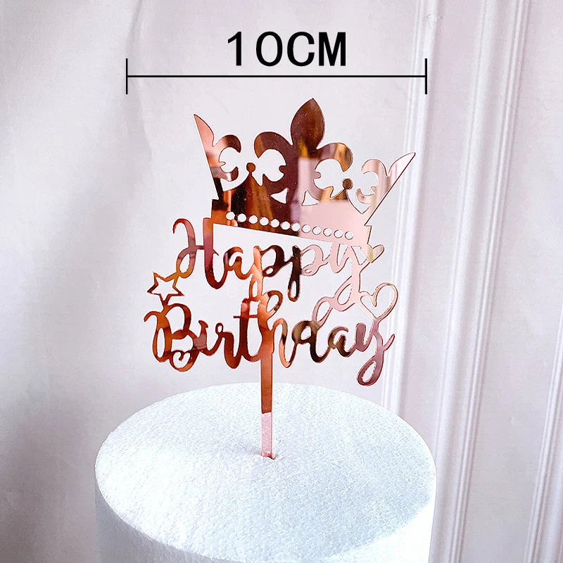 Rose gold acrylic happy birthday cake topper on a white cake stand