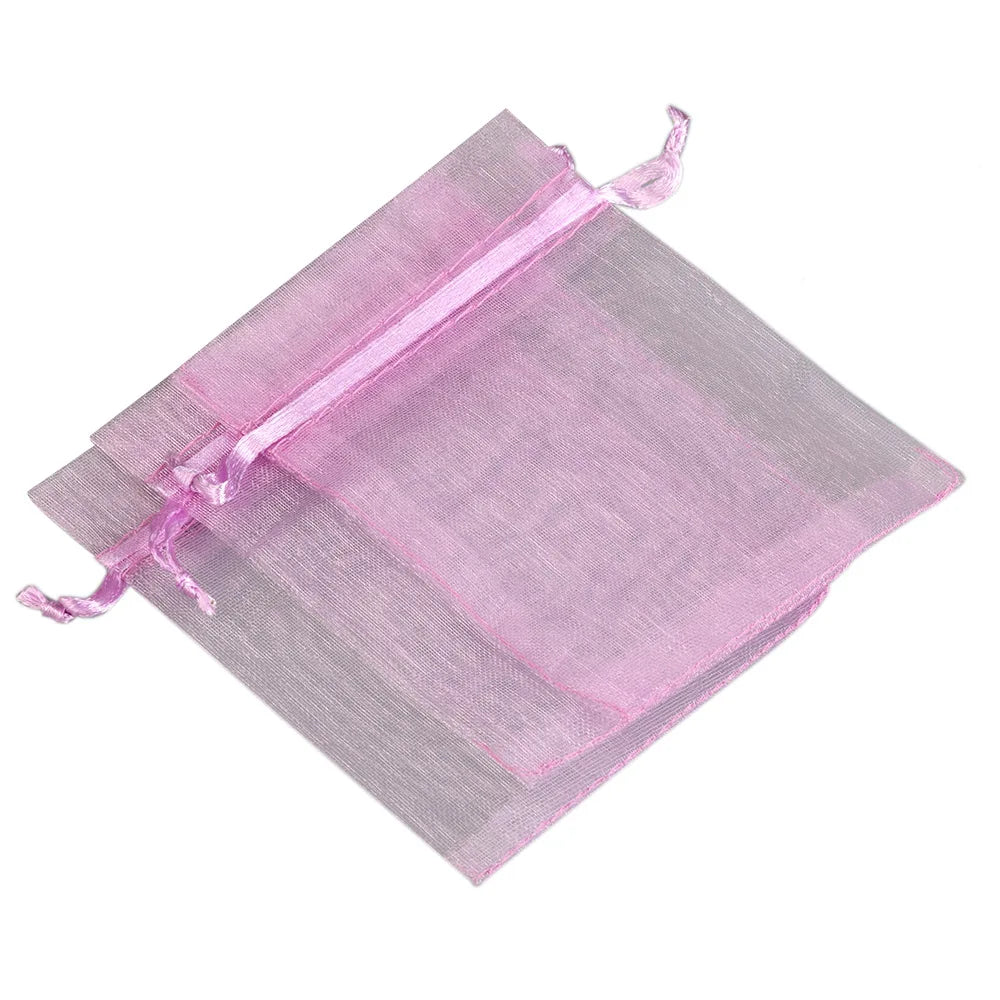 A translucent pink organza drawstring gift pouch for jewelry, candy, or party favors.