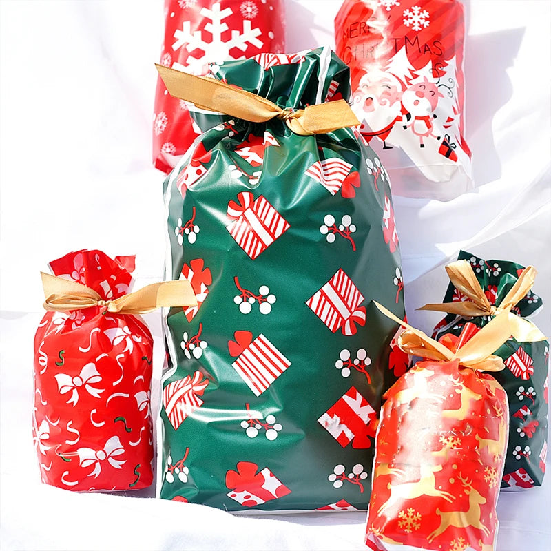 A collection of festive Christmas drawstring gift bags featuring snowflake and Santa designs in red, green, and gold.
