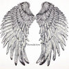 A pair of large silver sequin wing patches for DIY sew-on or iron-on embellishment.