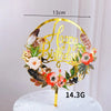 Rose gold acrylic happy birthday cake topper featuring floral and feather accents