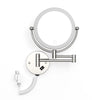 A round, wall-mounted LED makeup mirror with a magnifying feature and a flexible cord.