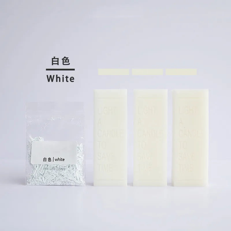 White eco-friendly soy candle dye colorants in small rectangular containers labeled White