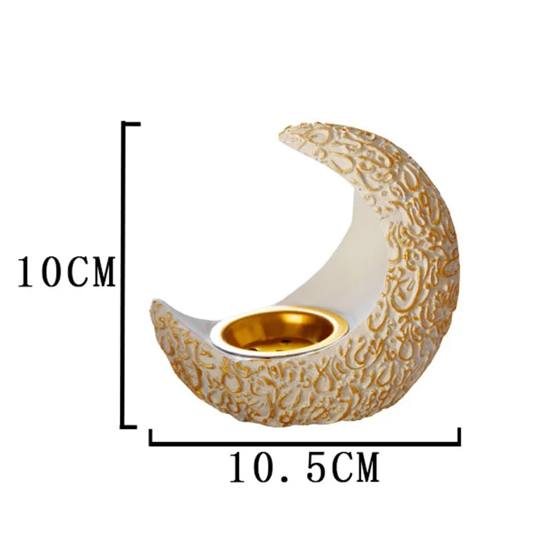 A golden antique crescent shaped resin incense burner with a textured surface.