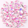A mix of silver claw setting glass rhinestones in jelly candy AB colors scattered on a white background.