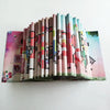 A display of 10 colorful tubes of fuse beads for DIY ironing projects arranged in a vertical row.