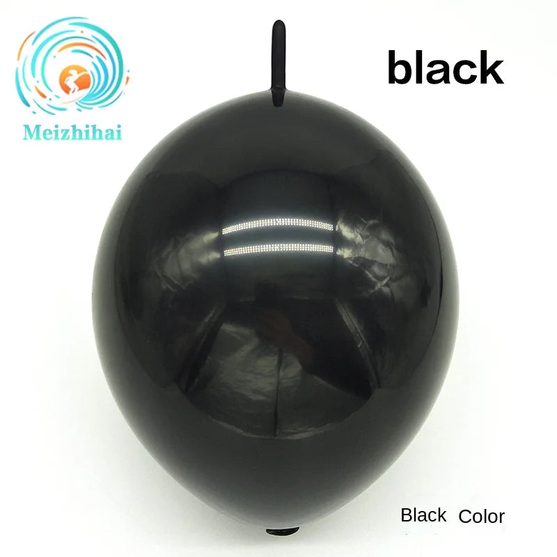 A glossy black latex balloon is shown against a white background.