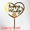 Gold acrylic heart-shaped birthday topper with handwritten text and a rose detail