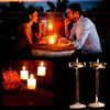 A couple enjoying a romantic evening with candlelight dinner, featuring elegant glass candle holders.