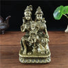 Hand-finished resin figurine of a Hindu or Buddhist deity with a child seated on a pedestal