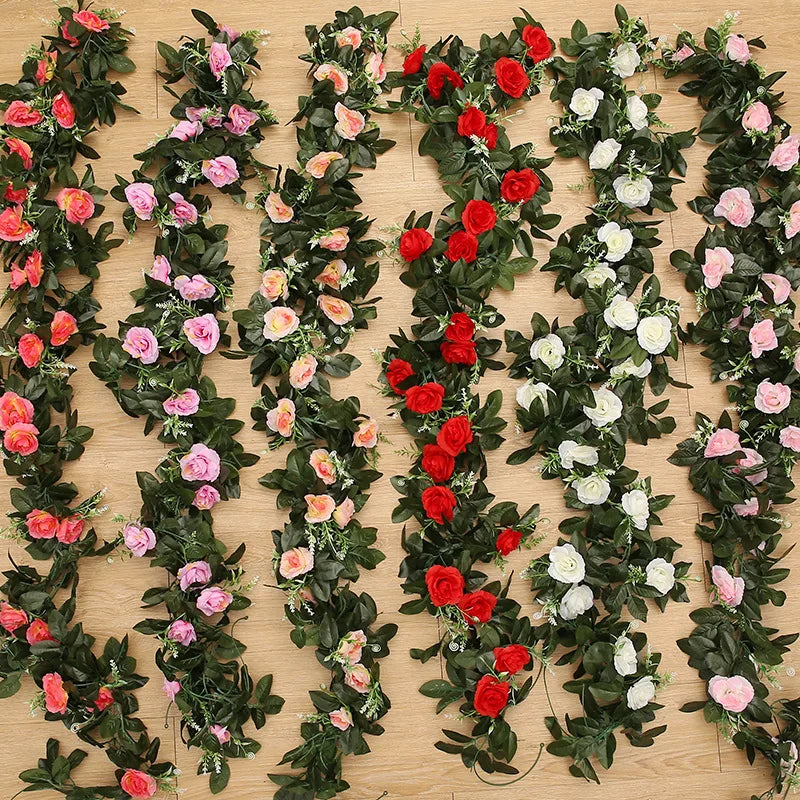 A lush green silk rose hanging vine garland featuring pink, red, and white roses for weddings and home decor.
