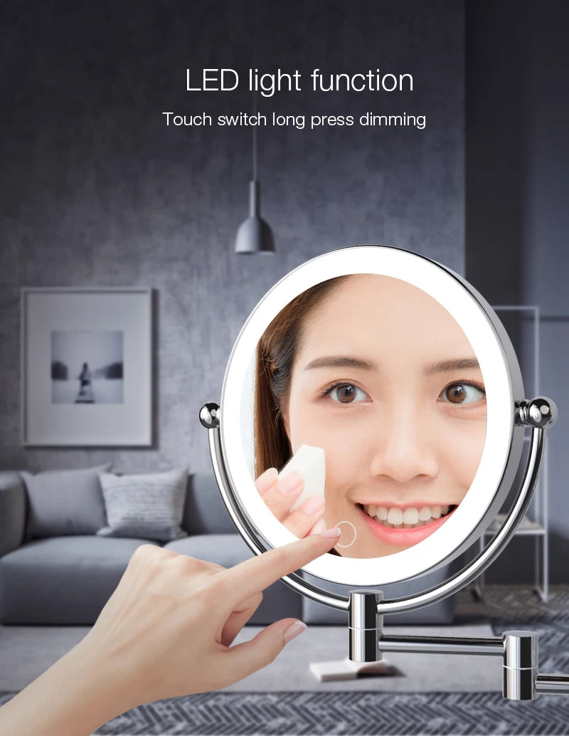 A hand is touching the sensor of a round LED makeup mirror used for dimming light.