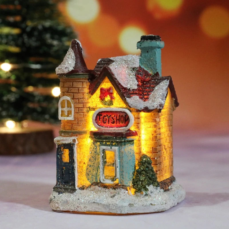 A festive Christmas house night light shaped like a brick building with warm LED glow and snow accents.