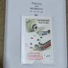 A clear plastic photo album titled Pieces of Moment for Instax mini made in China featuring colorful daydream themes.