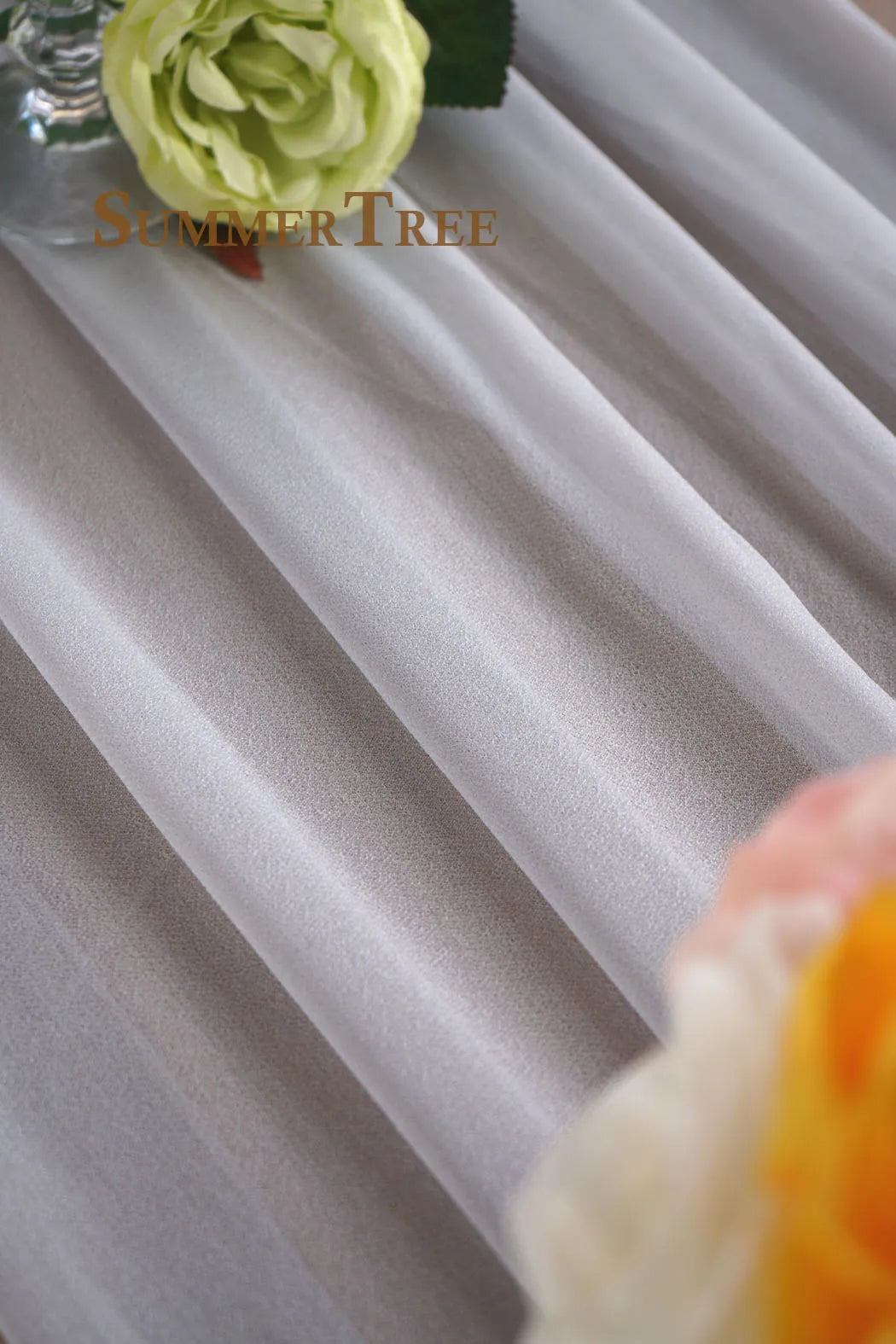 Elegant chiffon wedding arch drape fabric in light gray and white tones