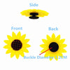 Three views of a yellow cartoon dinosaur PVC shoe charm showing the side, front, and back.