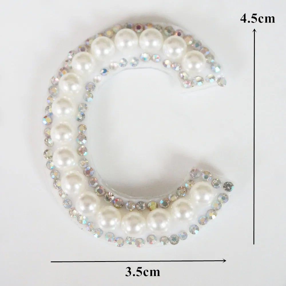 A white pearl and rhinestone letter C patch for clothing, measuring 4.5cm high and 3.5cm wide.