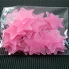 A clear plastic package containing a 50 pack of pink glow-in-the-dark star wall stickers.