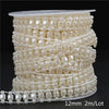 A spool of ivory pearl beads used for making garlands, packaged with a size indicator.