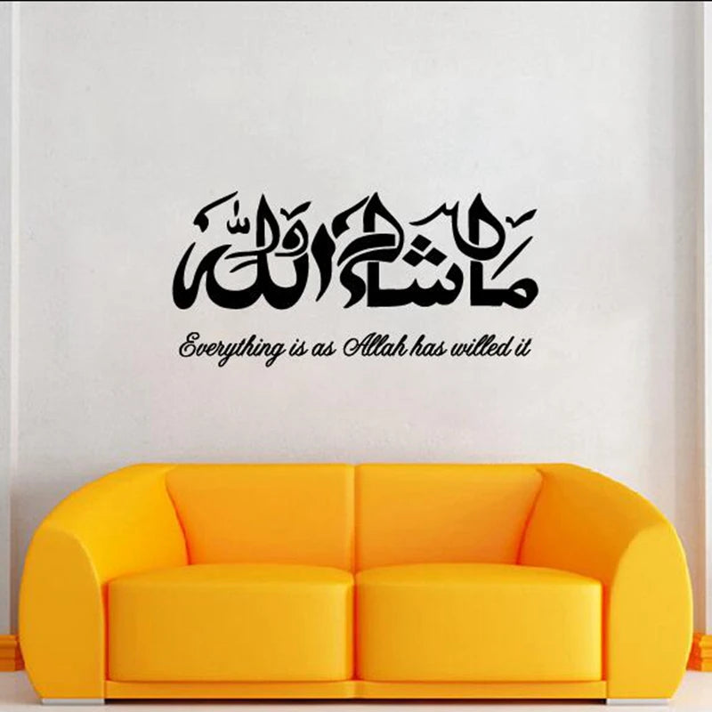 A bright yellow sofa against a white wall featuring black Arabic and English calligraphy text.