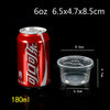 A red aluminum can of a liquid product next to a clear plastic dessert cup with a lid.