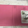 A pink photo album titled Pieces of Moment with a section showing an Instax mini camera.