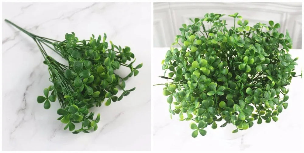 A cluster of vibrant green artificial fern and leaf sprigs for home decor