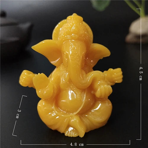Handcrafted yellow Buddha statue for home and garden, shown from above.