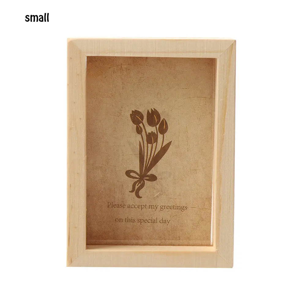 A small wooden photo frame with a light brown background featuring a delicate floral design and text.