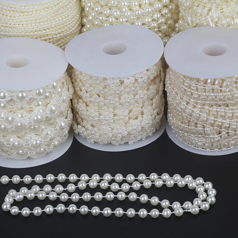 Rolls of ivory pearl beads and a finished pearl bead garland for wedding and event decoration
