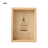 A light wood photo frame with a decorative birdcage silhouette etched into the glass.