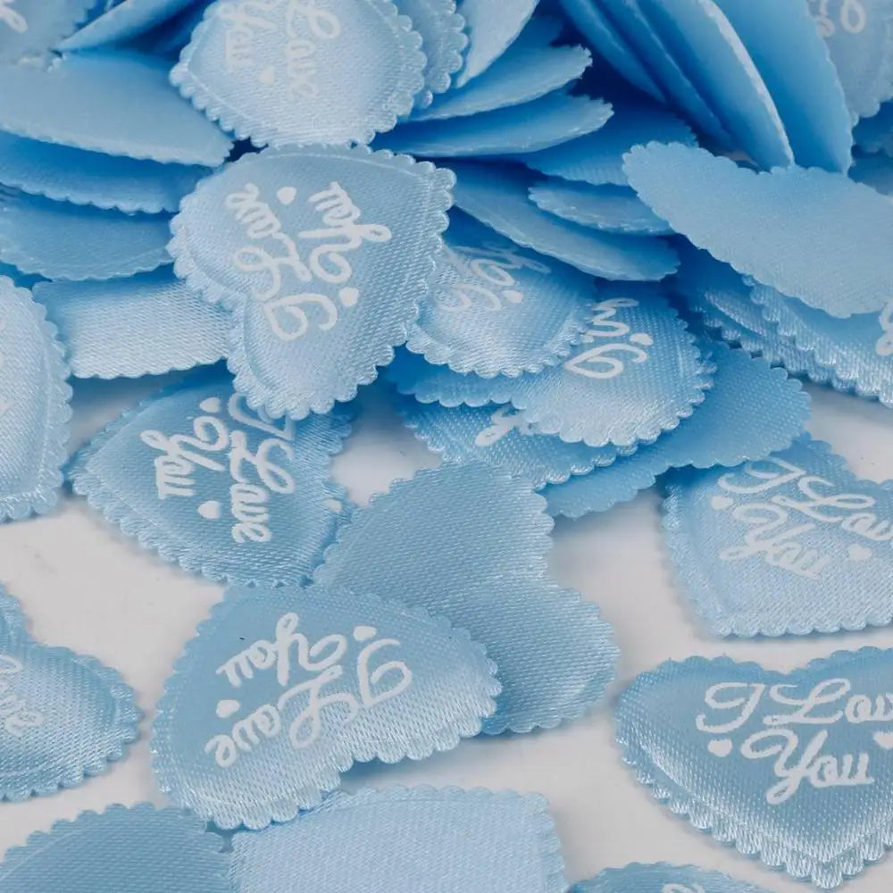 A pile of light blue heart-shaped sponge confetti for weddings and celebrations.