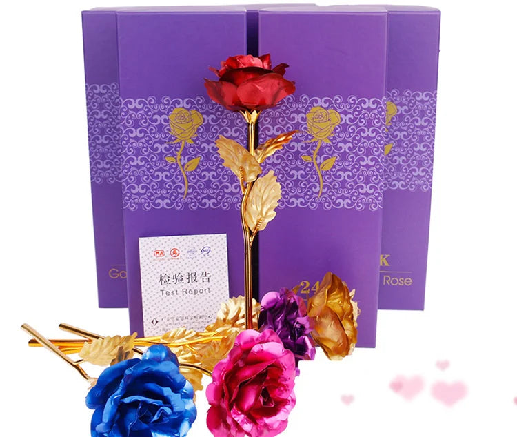 A bouquet of artificial roses with gold foil accents displayed in purple gift boxes.