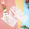 Pair of sheer white lace gloves displayed on a pink and blue background with a pink rose and a tulip.