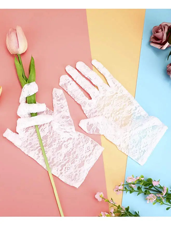 Pair of sheer white lace gloves displayed on a pink and blue background with a pink rose and a tulip.