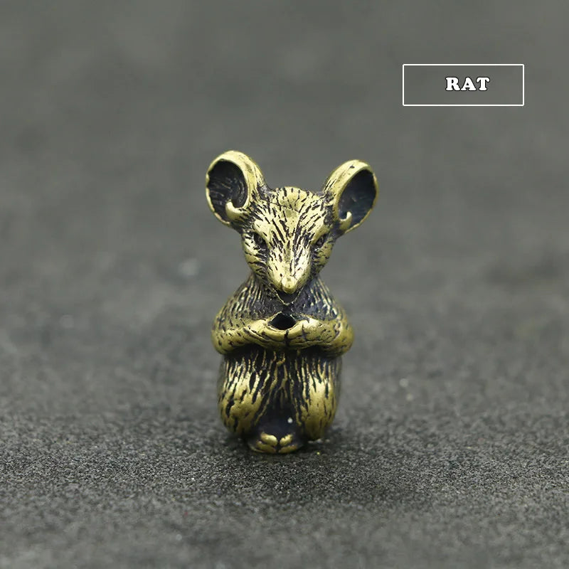 Brass statue of a rat with large ears, designed as an incense holder.