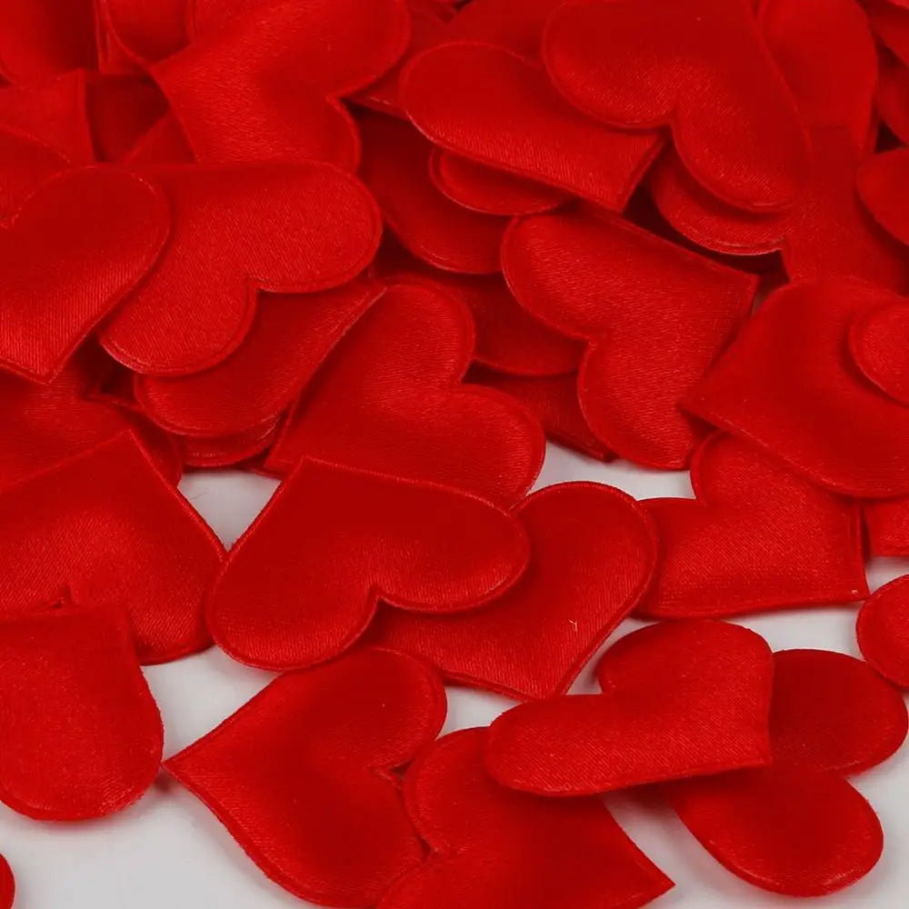 A pile of red heart-shaped sponge confetti for weddings and celebrations.