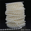 A spool of ivory pearl beads used for garland decoration, measuring 6mm in diameter and 5 meters long per lot.