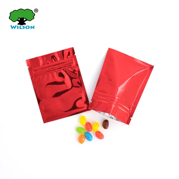 Red foil zip bags containing colorful candies or small items for gifts and packaging