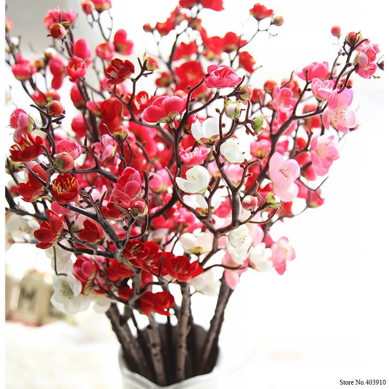 Artificial silk cherry blossom branches featuring pink and red flowers on dark branches