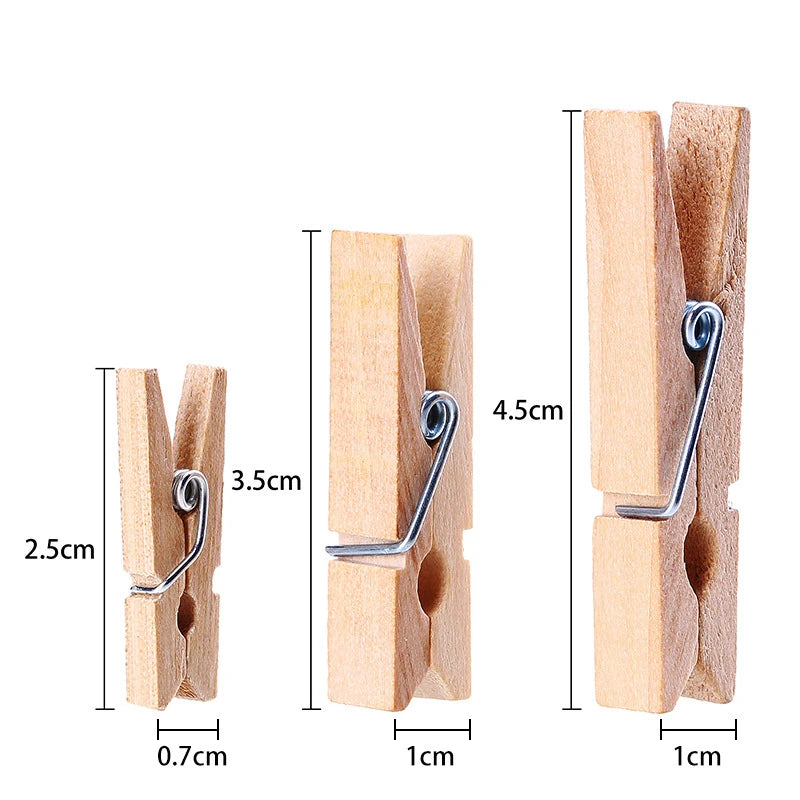 A set of natural wooden clips used for holding crafts, photos, and decor.