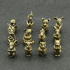 A set of brass Chinese Zodiac animal statues, including a mouse, rabbit, and other zodiac animals, used as incense holders.