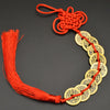 A necklace made of copper coins and a handwoven knot, used as an I Ching Feng Shui charm.