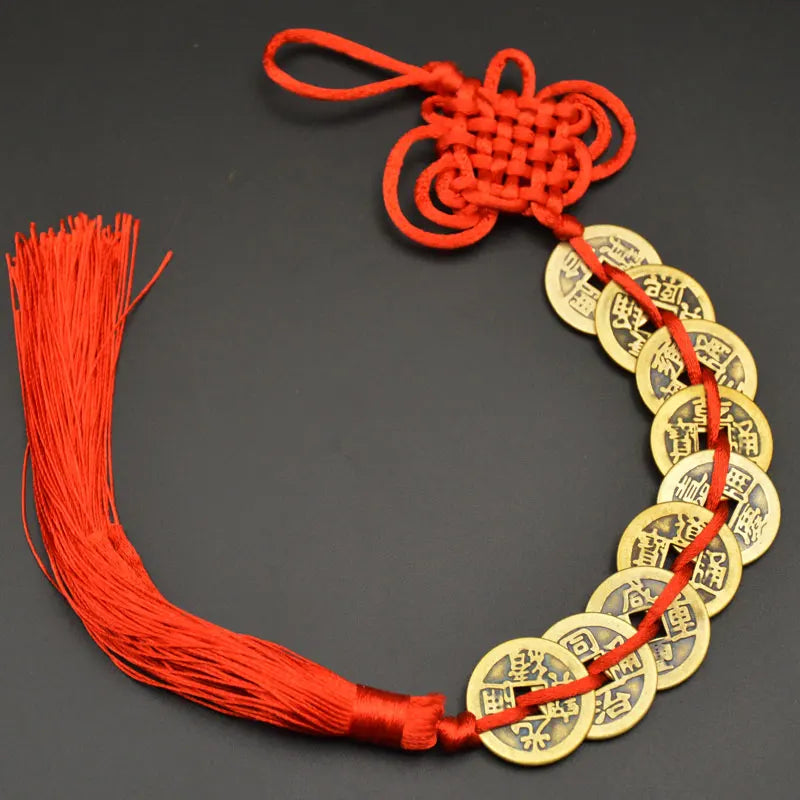 A necklace made of copper coins and a handwoven knot, used as an I Ching Feng Shui charm.