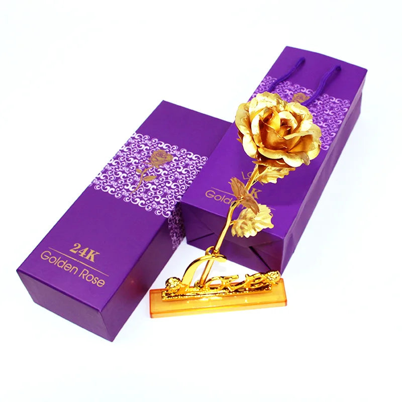 A purple box containing a 24K golden foil artificial rose bouquet.