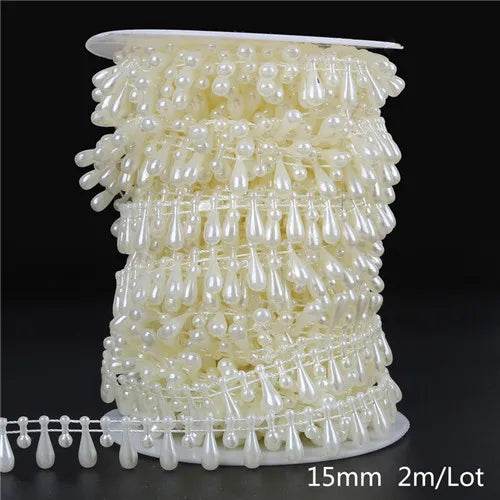 Ivory pearl bead garland featuring small, teardrop-shaped pearls arranged in multiple strands for decoration.