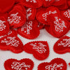 Red heart-shaped sponge confetti for weddings and celebrations
