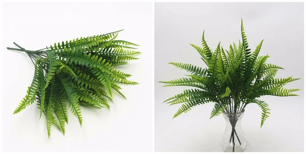 A sprig of vibrant green artificial fern leaves displayed in a clear glass vase.